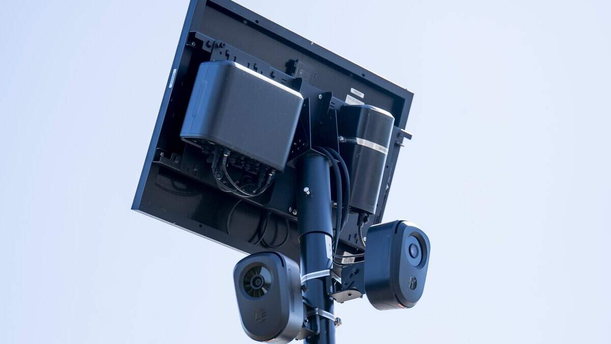 flock camera and solar panel on a pole